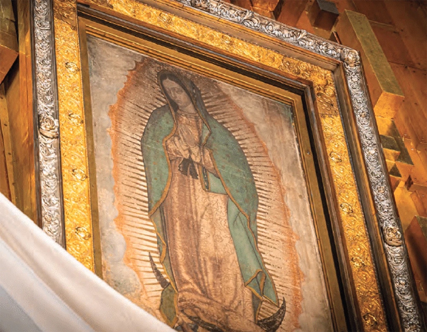 The tilma of Saint Juan Diego in its ornate silver-and-gold frame at the Basilica of Guadalupe, Mexico City